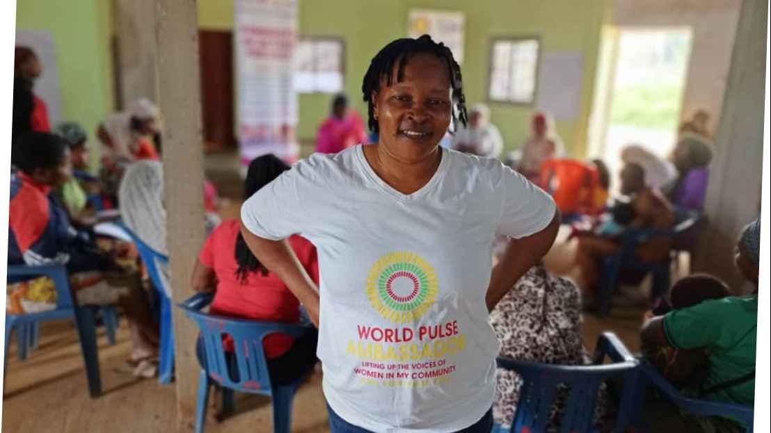 Woman wearing a white T-shirt written in front World Pulse Ambassador  